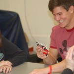 Carrie Kann, Nathan Moeller, and Alyssa Teterud compete in a game of UNO. Photo by DeAnna Thomas